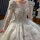 فستان زفاف كلاسيك بتصميم فاخر، بأكمام طويلة، مصنوع من الدانتيل ومطرز بالخرز من بابلون ديزاينر